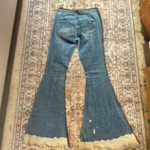 Classic Blue Flare Jeans with Distressed Hem